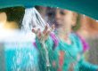 Young child enjoys interactive water activity to engage senses and support development